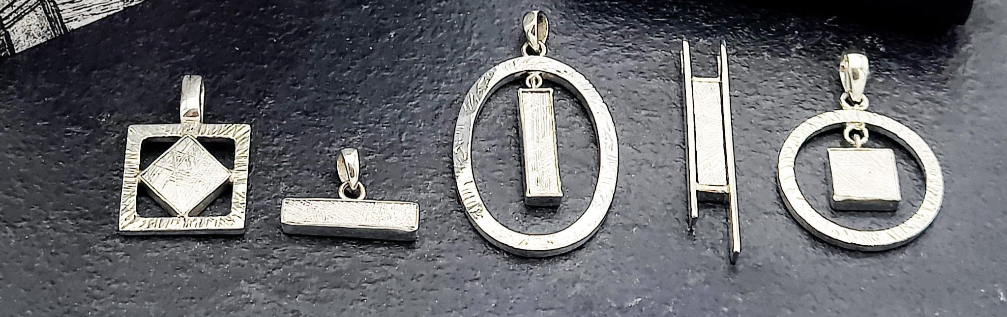 Collection of meteorite sterling silver pendants