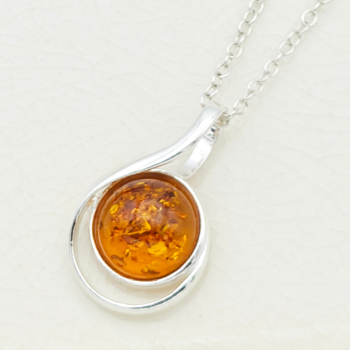 Hepburn and Hughes Baltic Amber Pendant | 22m Round Swirl | November Gift | Sterling Silver