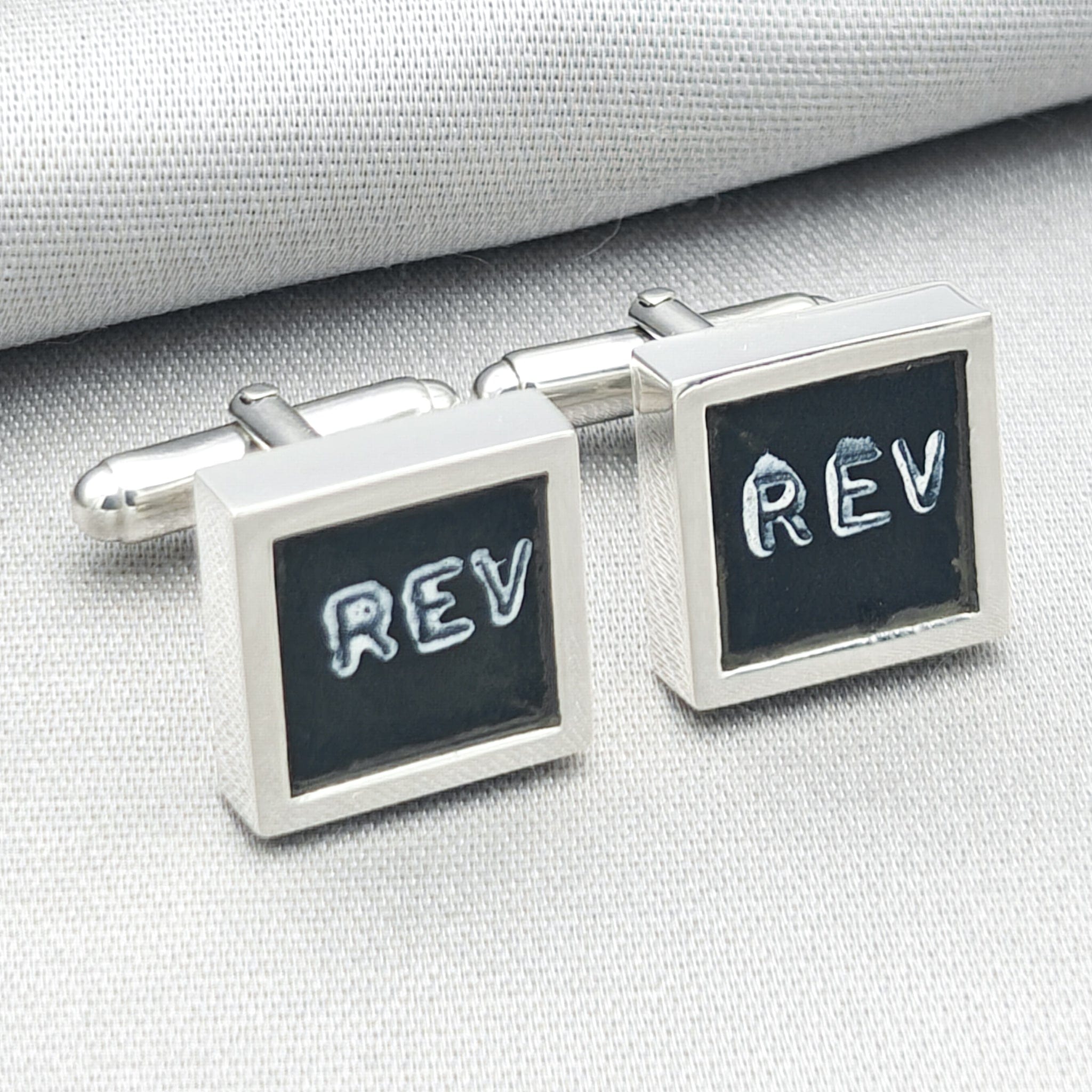 chinook cufflinks on pale background with REV text visible from instrument panel