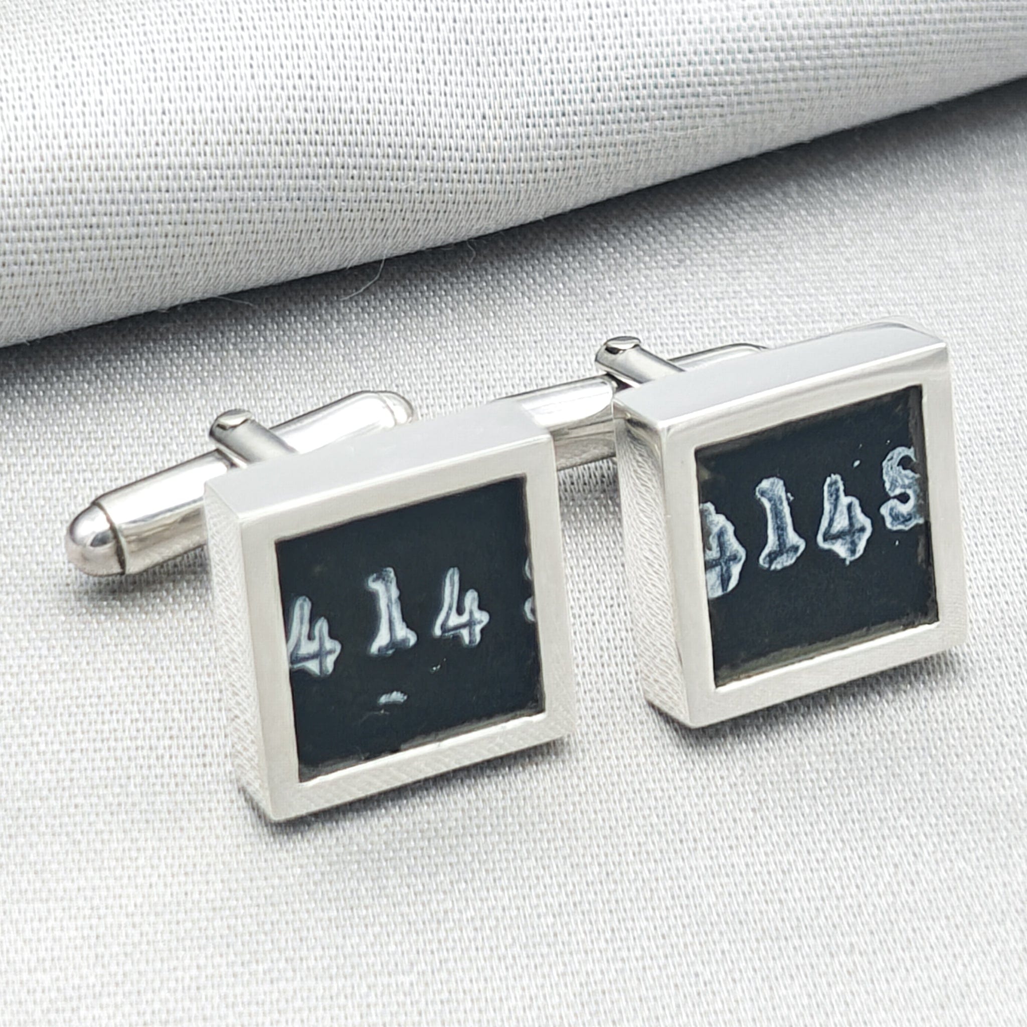chinook cufflinks on pale background with numbers visible from instrument panel