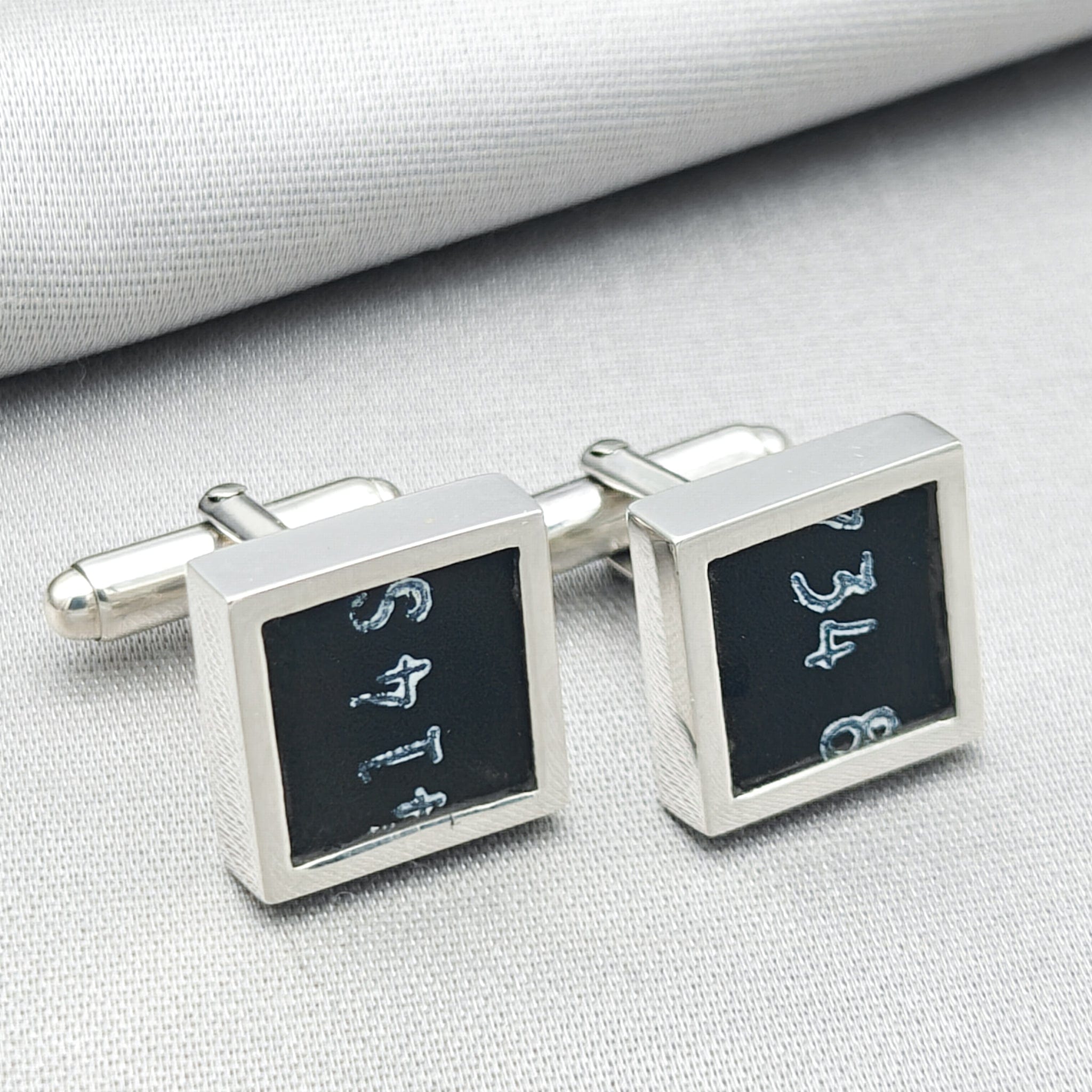 chinook cufflinks on pale background with numbers visible from instrument panel