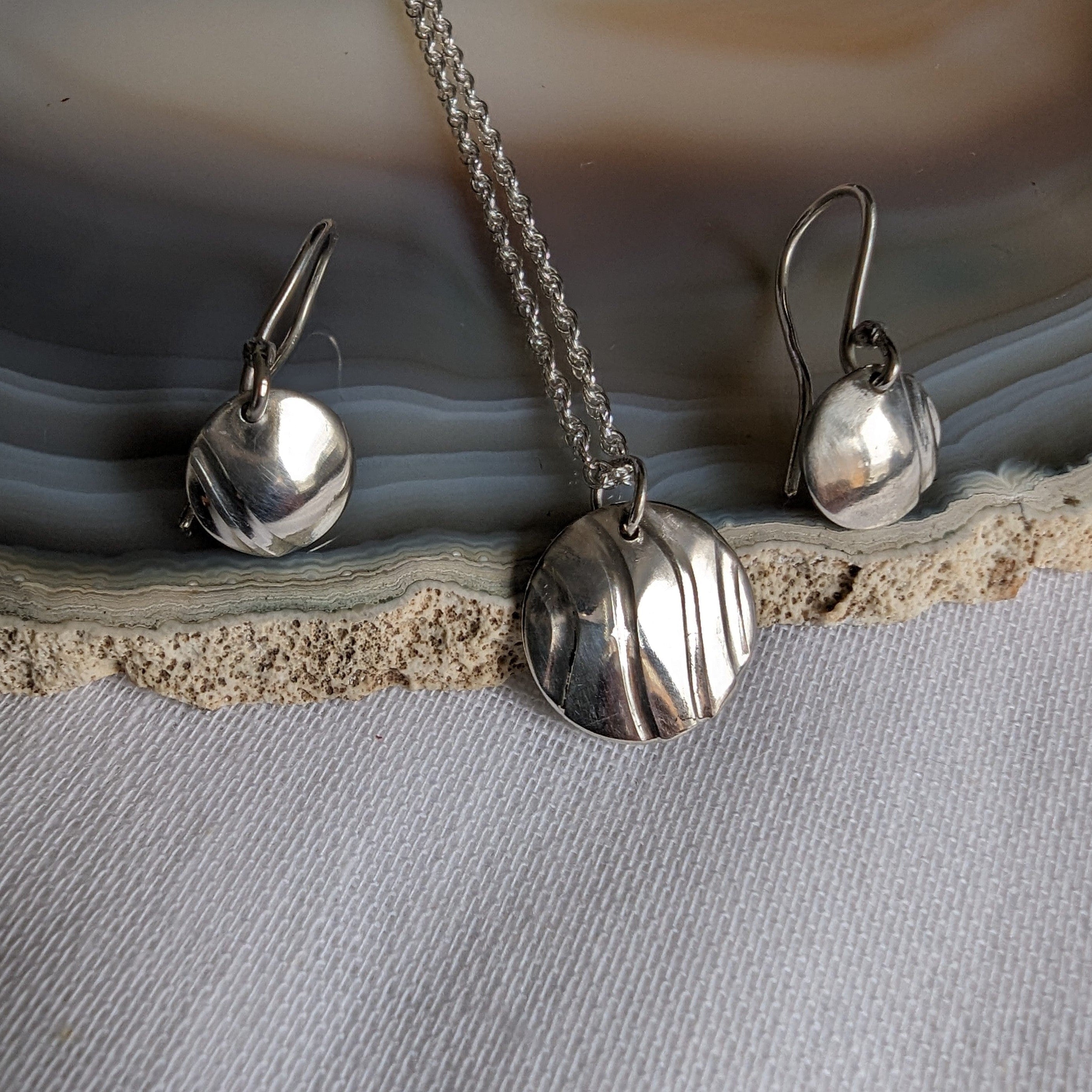 Dezanne Design Ecosilver Round Earrings with wavy textured design