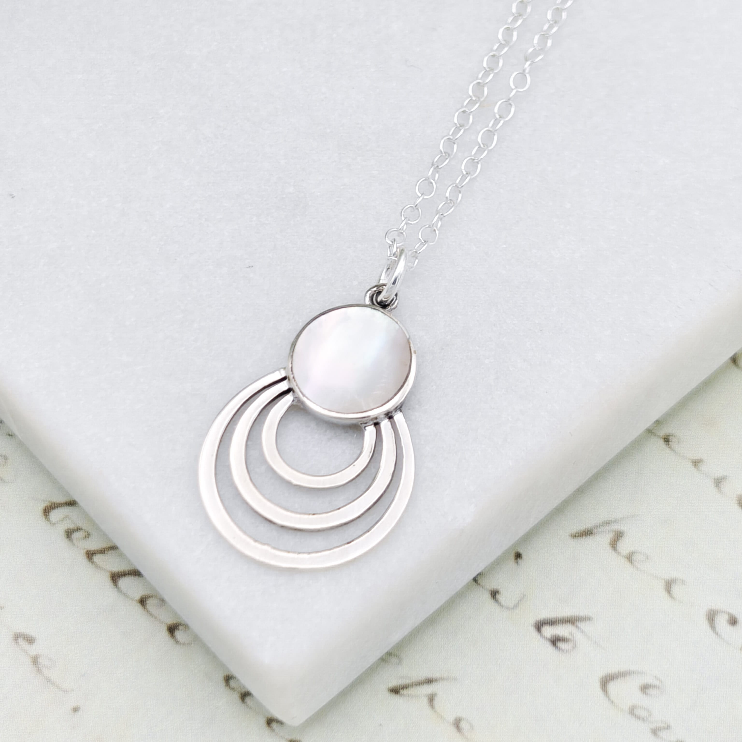 Hepburn and Hughes Mother of Pearl circle pendant in sterling silver | June Birthday Gift