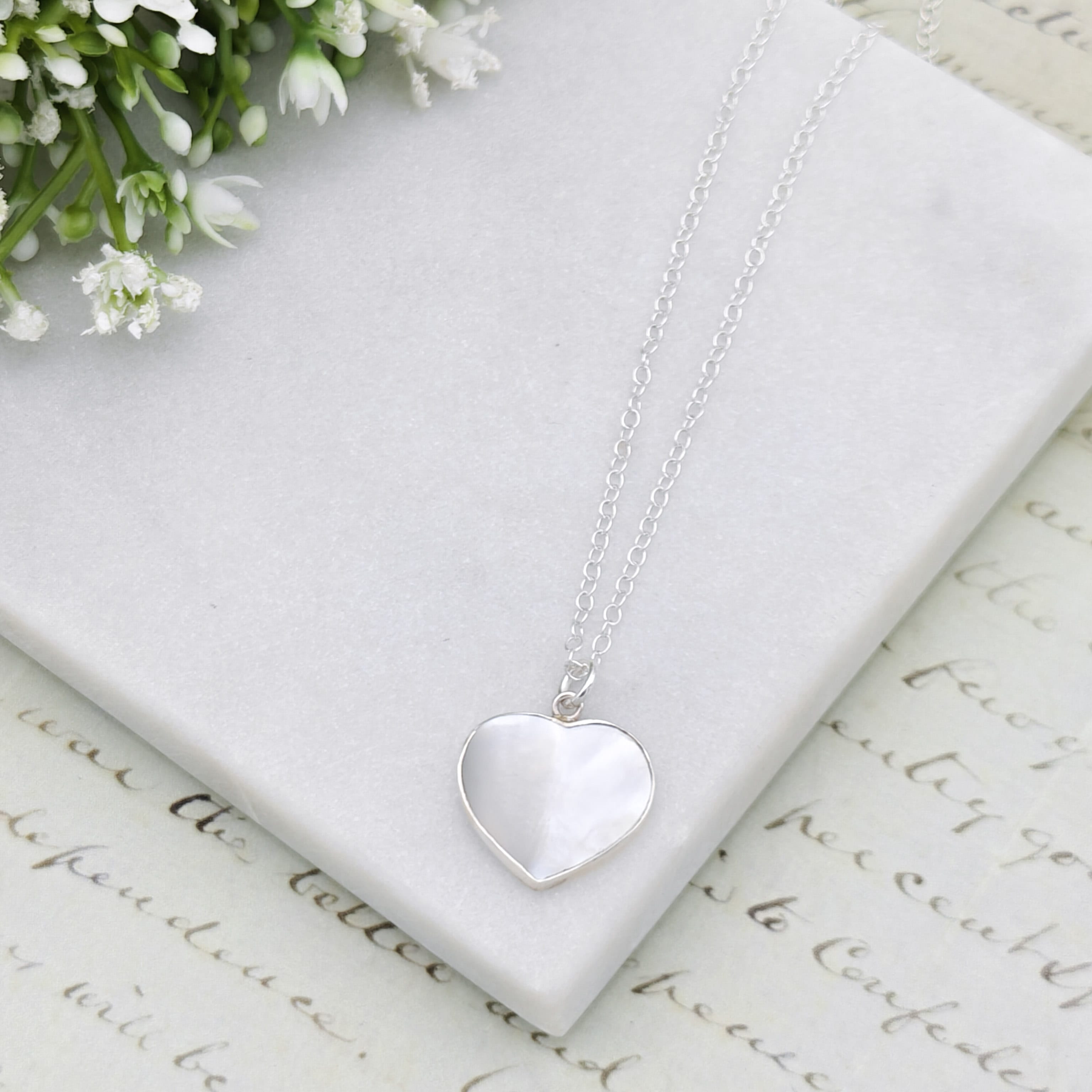 Hepburn and Hughes Mother of Pearl hanging heart pendant in sterling silver | June Birthday Gift