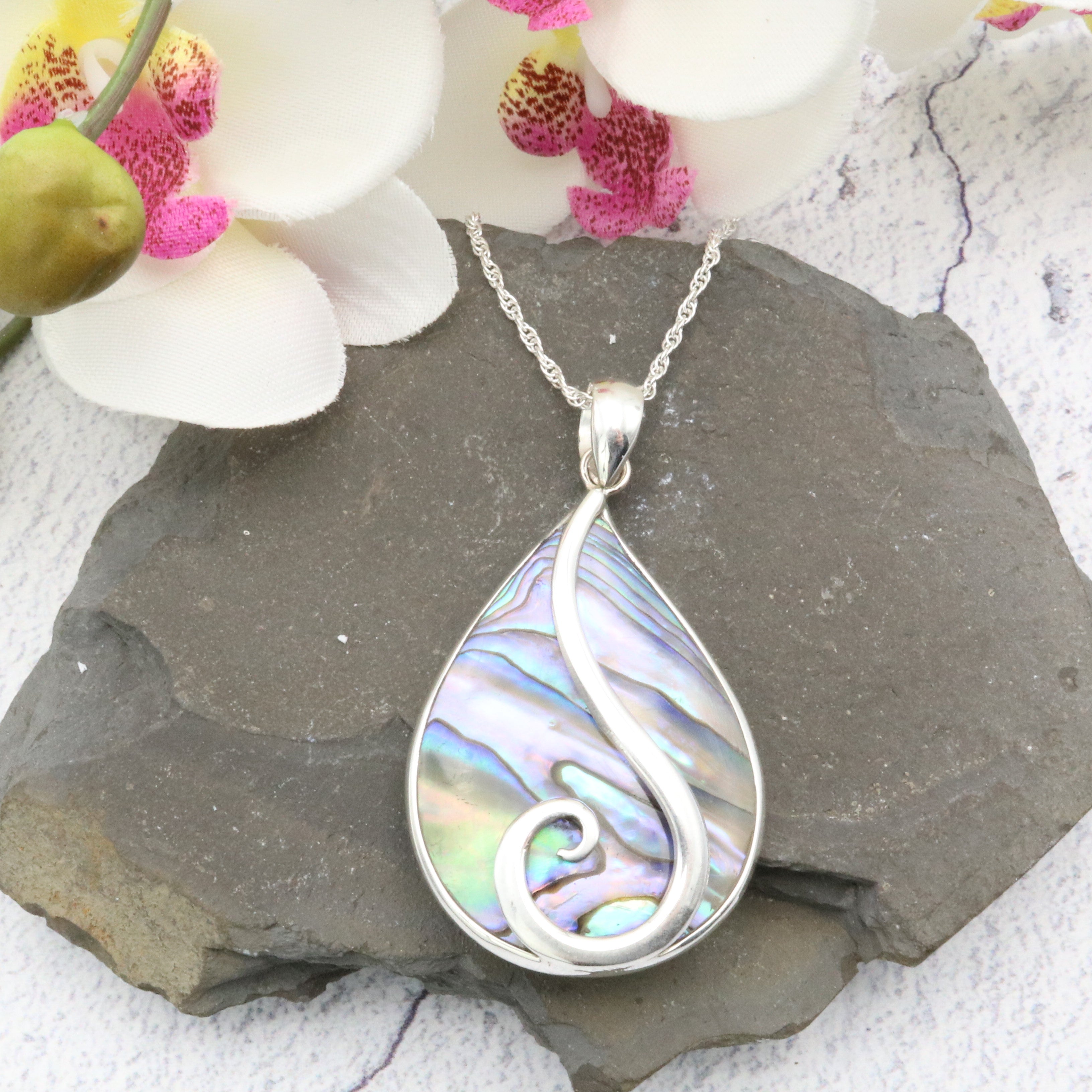 Abalone pendant, teardrop shape with a sterling silver swirl