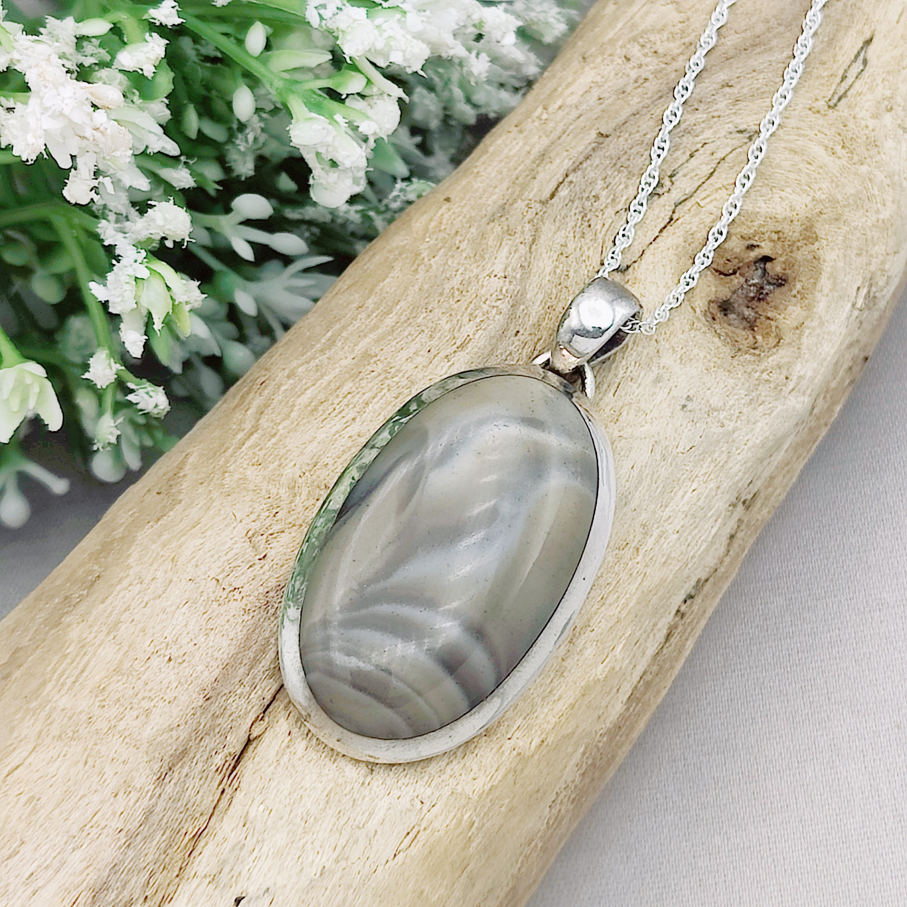 Polish Flint oval pendant set in sterling silver