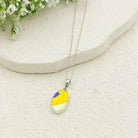 Hepburn and Hughes Art Deco Pendant | Clarice Cliff Wind Bells Pottery | 20mm Oval |  Sterling Silver