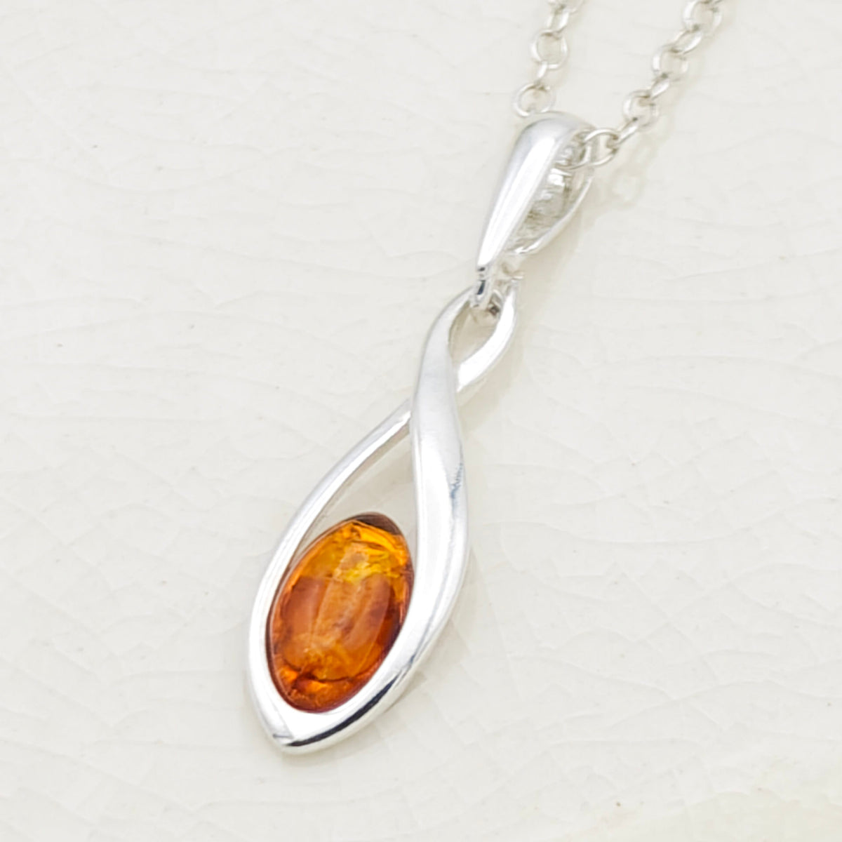 Hepburn and Hughes Baltic Amber Pendant | 20mm hanging Oval | Sterling Silver