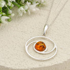 Hepburn and Hughes Baltic Amber Pendant | 22m Round Swirl | November Gift | Sterling Silver