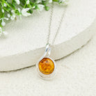 Hepburn and Hughes Baltic Amber Pendant | 22m Round Swirl | November Gift | Sterling Silver