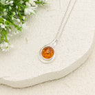 Hepburn and Hughes Baltic Amber Pendant | 22m Round Swirl | November Gift | Sterling Silver