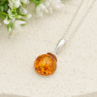 Hepburn and Hughes Baltic Amber Pendant | Cognac or Green | Circular | Sterling Silver
