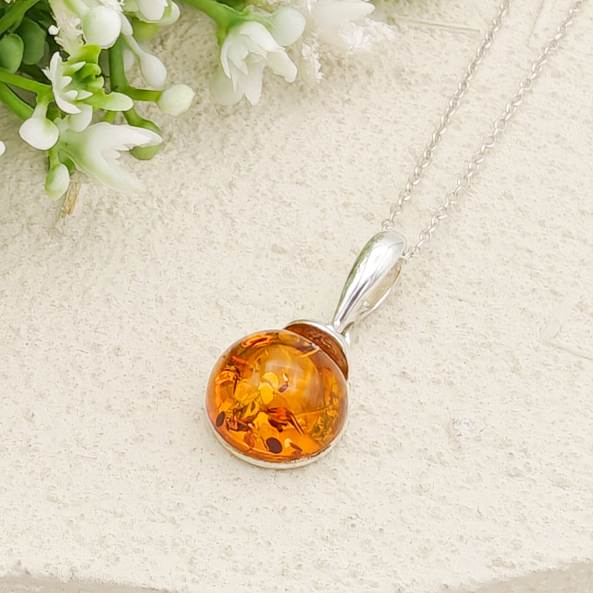 Hepburn and Hughes Baltic Amber Pendant | Cognac or Green | Circular | Sterling Silver