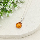 Hepburn and Hughes Baltic Amber Pendant | Cognac or Green | Circular | Sterling Silver