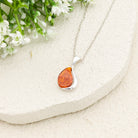 Hepburn and Hughes Baltic Amber Pendant | Oval in Teardrop Frame | Sterling Silver