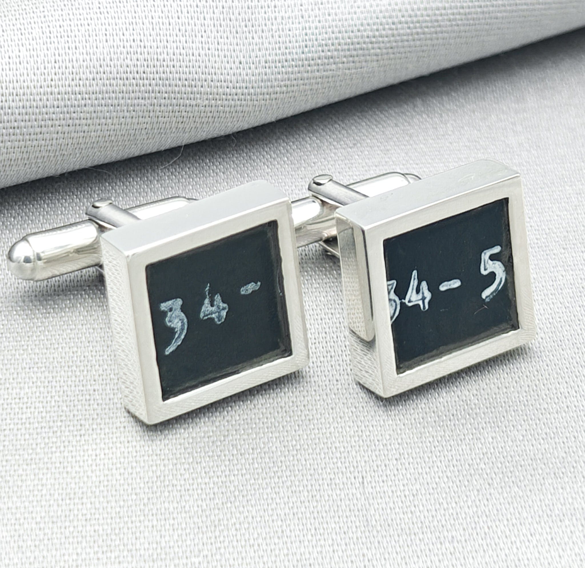 chinook cufflinks on pale background with '34-5' text visible from instrument panel