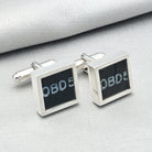 chinook cufflinks on pale background with OBD text visible from instrument panel