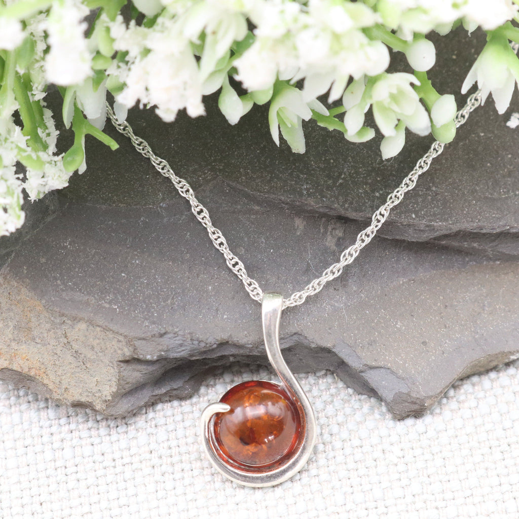 Hepburn and Hughes Baltic Amber Pendant, Circular stone with swirl in Sterling Silver