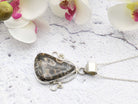 Hepburn and Hughes Fossilised Turritella Shell Pendant, Curved Triangle in Sterling Silver